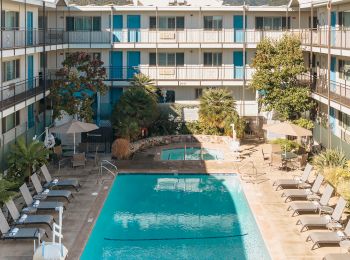 arial view of beautiful pool and hot tub in courtyard
